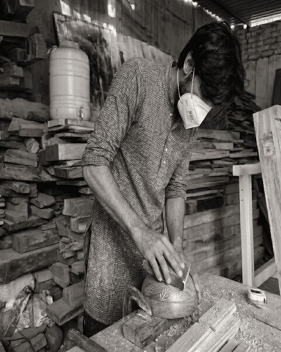 Artisan crafting wooden furniture