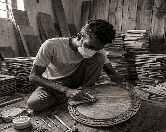 Artisan finishing a wooden piece